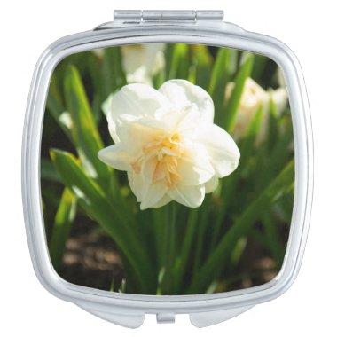Big white daffodils on a spring day compact mirror