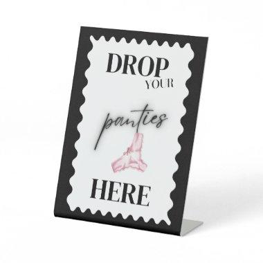 Black and white drop your panties here game sign