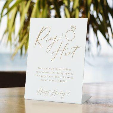 Gold minimal script ring hunt  game pedestal sign