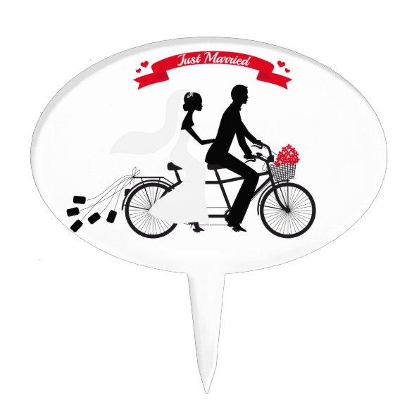 Just married bride and groom on tandem bicycle cake topper