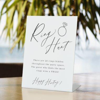 Minimalist script ring hunt  game pedestal sign