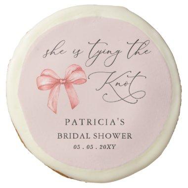 She is tying the knot pink bow  Sugar Cookie