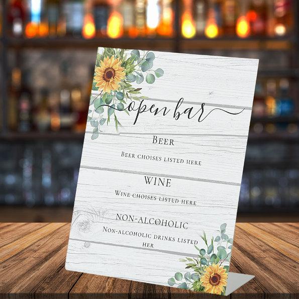 Sunflowers eucalyptus greenery wood bar menu pedestal sign