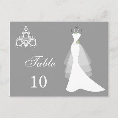 Wedding gown, chandelier on grey Table number